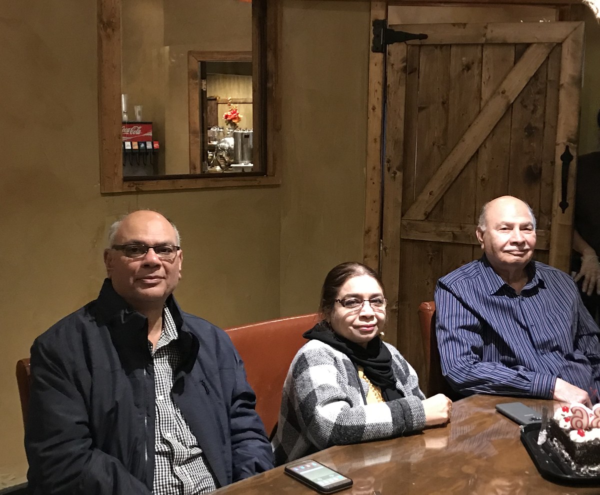 Aslam Hayat at the birthday dinner table with family, Vancouver