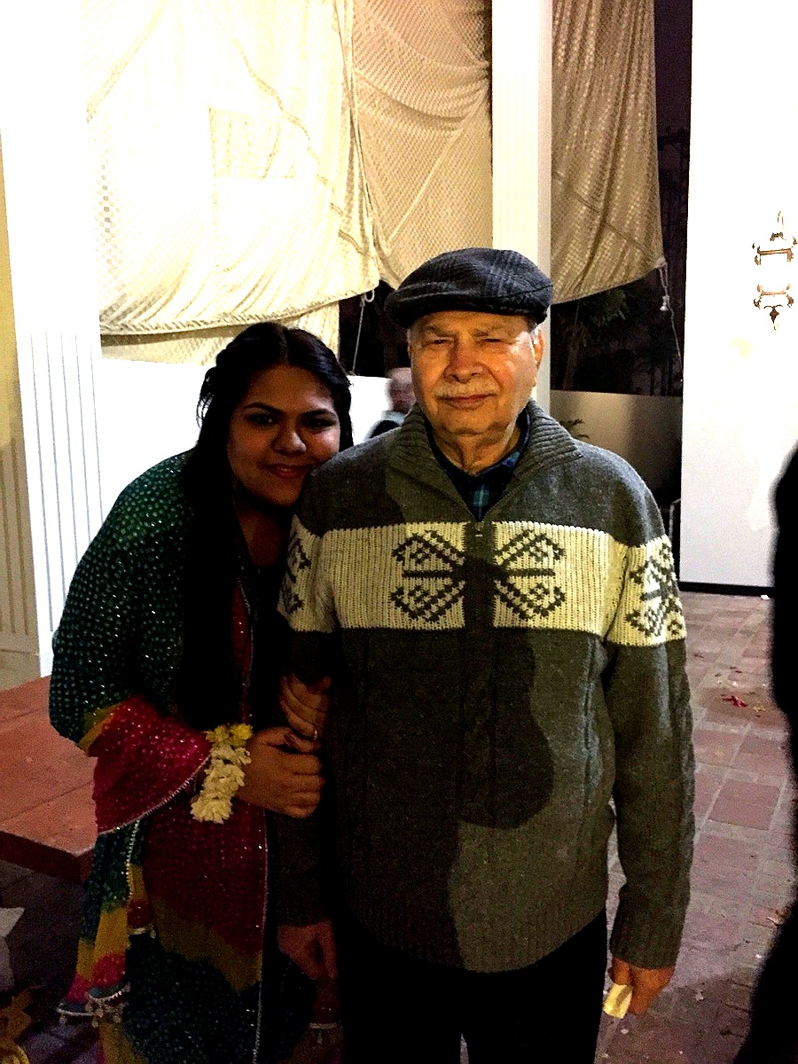 Aslam Hayat with a family member at a gathering in his later years