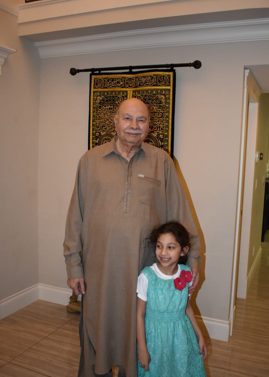 Aslam Hayat with his granddaughter at home in Vancouver