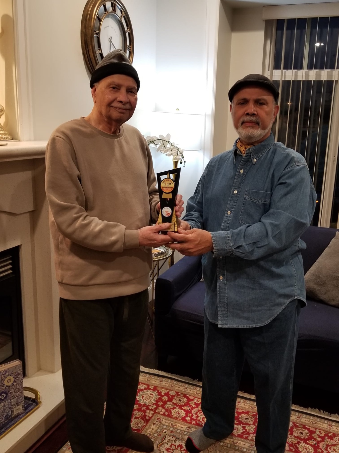 Aslam Hayat being recognised by Mr. Pirzada of Miracle News for his years of contribution