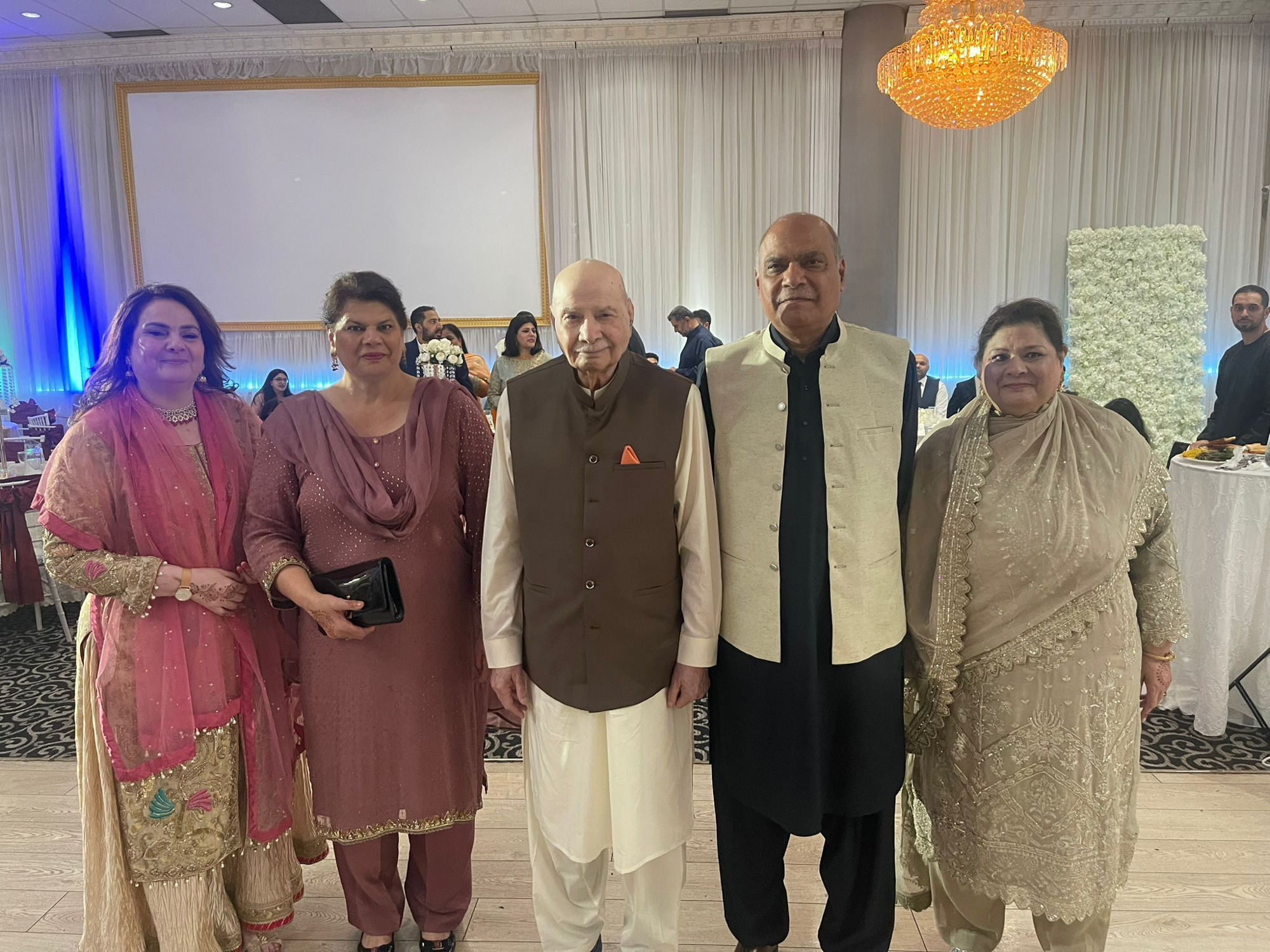 Aslam Hayat with his children at a formal occasion