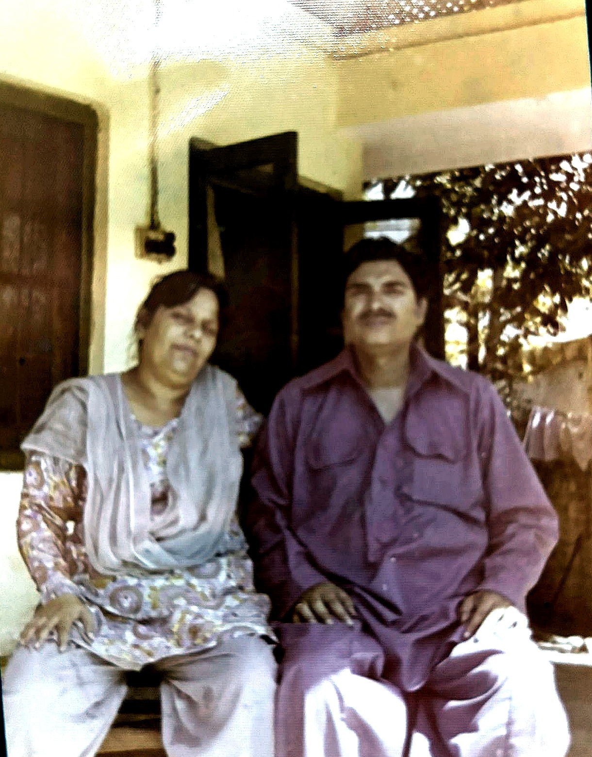 Aslam Hayat seated with his wife Suriya Hayat on the veranda, Pakistan